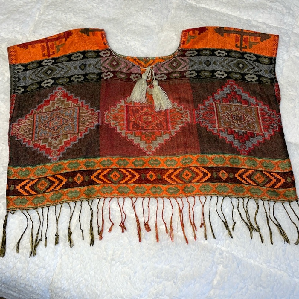 Handmade multi colored Mexican Blouse/croptop.
Fits Xs to M.